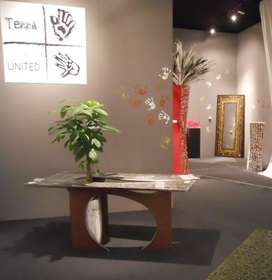 Table with PACHIRA plant and hourglass vase